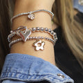 Silver plated and faux gold retro daisy charm bracelet