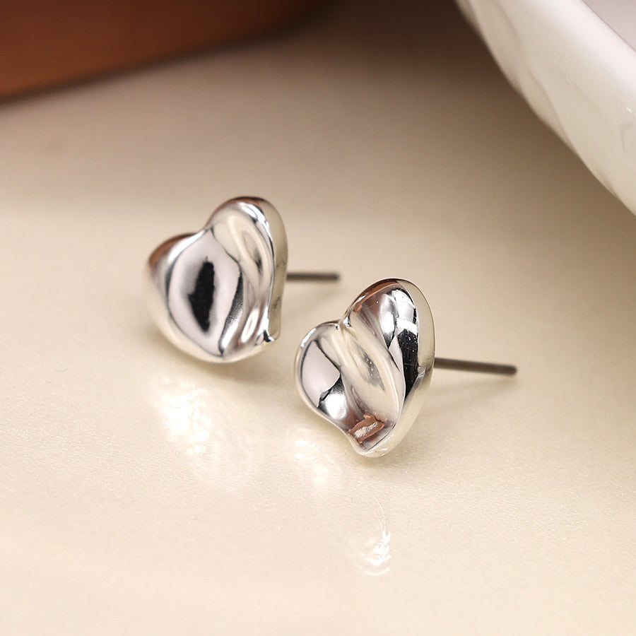 Silver plated wavy surface heart stud earrings