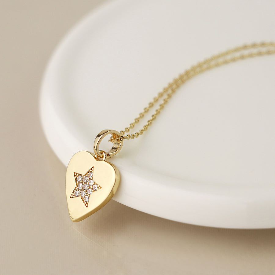 Golden heart necklace with pave crystal star