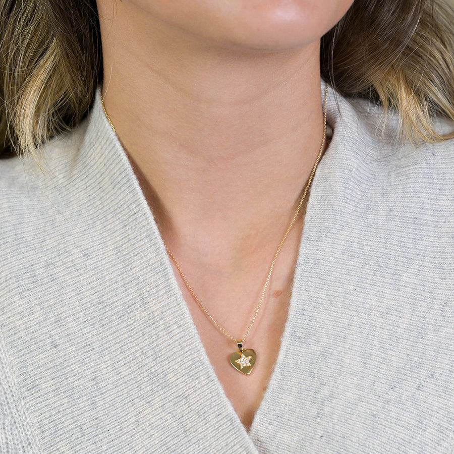 Golden heart necklace with pave crystal star